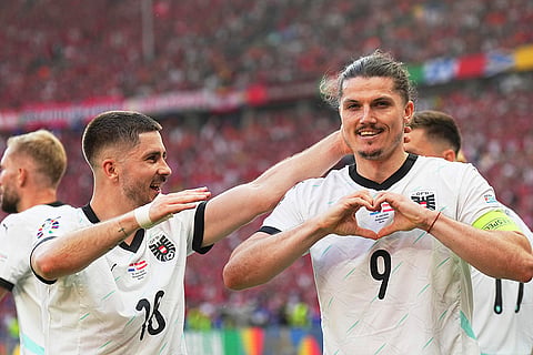 Marcel Sabitzer celebrates after scoring his side's third goal